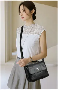 Classic black soft leather women crossbody bag, elegant single shoulder strap, daily fashion design.