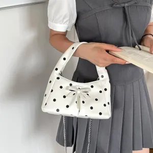 White polka dot underarm bag for women, vintage handbag with bow and metal chain strap.