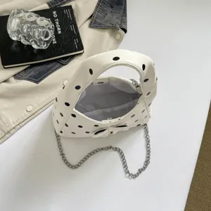 White polka dot underarm bag women handbag with chain strap and cute bow, casual retro style.