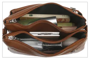 Detailed top view of brown PU leather handbag interior showing multi-compartment capacity.