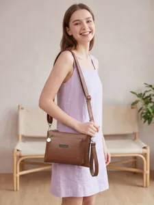 Brown PU leather crossbody bag for women, stylish multi-compartment shoulder phone purse.