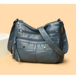 Detail view of dark blue PU leather multi-pocket casual shoulder crossbody bag for women.