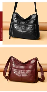 Close-up details of multi-pocket soft PU leather women shoulder bag zipper and stitching design.