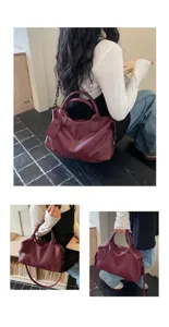 Detailed close-up showing burgundy soft leather handbag texture, handles and carrying styles.