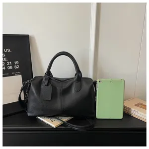 Detail view of black soft leather shoulder bag, casual crossbody design with large capacity.