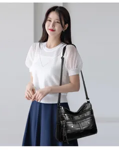 Fashion soft PU leather multi-pocket shoulder crossbody bag for women, casual daily use style.
