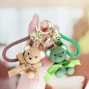 Resin woven texture sitting bear keychain with braided strap, cute cartoon bag pendant gift.