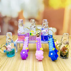 Cute liquid glitter soda bottle cartoon animal keychain bag pendant charm for car decoration.
