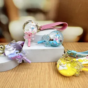 Cute liquid quicksand unicorn lollipop keychain pendant for women schoolbag charm accessory.