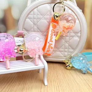 Cute floating liquid lollipop keychain, sparkling quicksand pendant for bags and car keys.