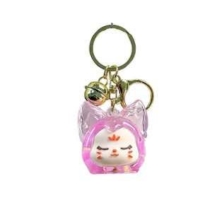 Schattige acryl zandloper fles sleutelhanger met roze cartoon pop hanger en gouden bel.