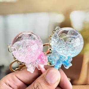 Liquid glitter lollipop keychain cute floating oil bow key chain for women girls bag charm