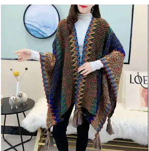 Ethnic colorblock knitted poncho for women, cozy tassel shawl cape for autumn and winter daily wear.