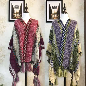 Ethnic color-block knitted cape for women, stylish fringe tassel design, cozy winter shawl.
