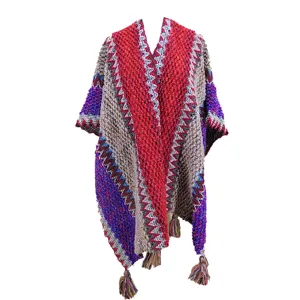 Ethnic color-block knitted poncho shawl for women, cozy winter tassel cape outerwear.