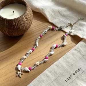 Detailed view of a summer beach style necklace featuring natural seashells and a starfish pendant