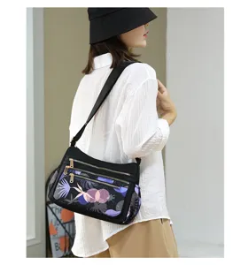 Multi-pocket nylon crossbody bag for women, casual single shoulder daily handbag detail view.