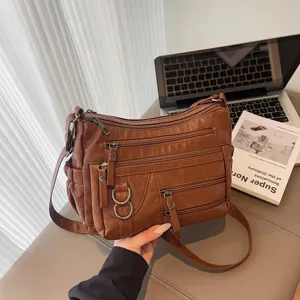 Retro bruine lederen schoudertas met meerdere ritsen voor dames, casual crossbody tas.