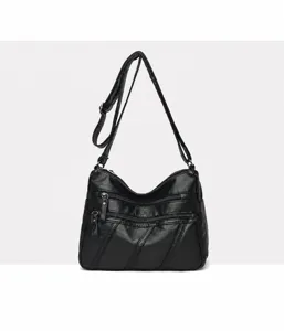 Black washed soft leather women shoulder crossbody bag detail view with multi zip pockets.