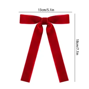 Red velvet bow ribbon with long tails, Christmas tree decoration and hair accessory.
