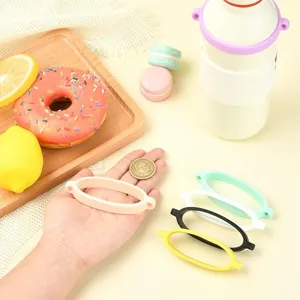 Silicone water bottle strap ring detail view, elastic portable handle loop in multi colors.