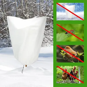 White non-woven plant frost cover for winter freeze protection. Durable tree protection bag.