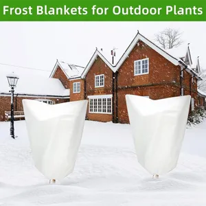 White plant frost blankets for outdoor winter garden protection, breathable non-woven covers.