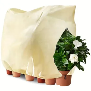 Plant frost protection cover with zipper and breathable non-woven fabric for winter garden care.
