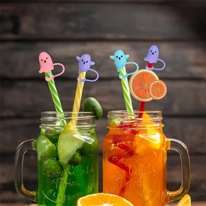 Detailed view of cute silicone ghost straw toppers in colorful drinks, perfect for Halloween.