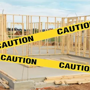 Yellow PE caution tape with black CAUTION text, ideal for construction safety and warning.