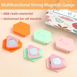 Details of the colorful magnetic sewing guide showing precision edges and strong magnet base.