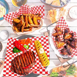 Red and white checkered greaseproof deli paper for wrapping burgers, fries, pizza, and fried food.