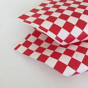 Red and white checkered greaseproof paper for food packaging, burger and fries deli paper.