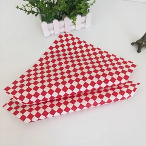 Red and white checkered greaseproof paper for food wrapping, burgers, and french fries.
