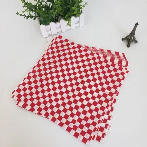 Red checkered greaseproof paper for food packaging, burger and fries wrapping sheet.
