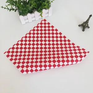 Red and white checkered greaseproof paper detail, ideal for food packaging and lining.
