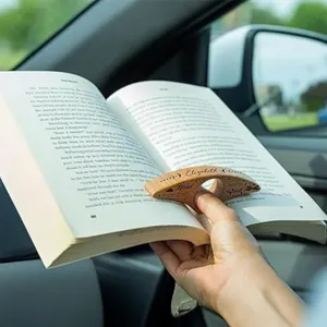 Wooden thumb book holder detail shot, ergonomic wooden reading ring bookmark for easy reading.