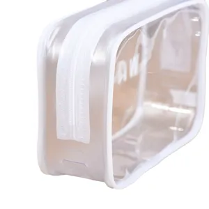 Clear PVC toiletry bag with white zipper, waterproof large capacity travel cosmetic pouch.