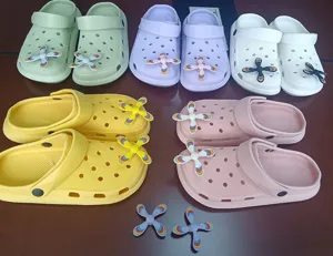 Cute EVA hole shoes with colorful rotatable propeller charms, multi-color casual clogs.