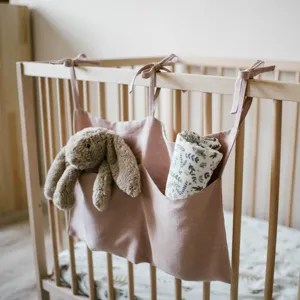 Linen baby crib hanging organizer double pocket storage bag for diapers and toys detail view
