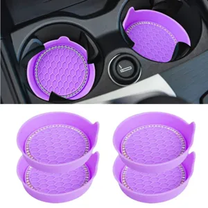 Closeup details of purple bling car cup holders featuring non-slip honeycomb texture and rhinestones.