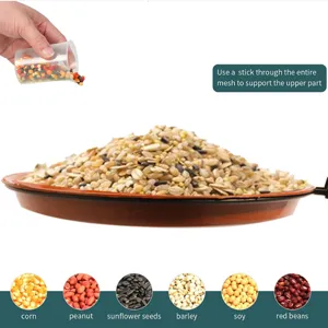 Outdoor wild bird feeder mixed seeds food tray with corn peanut sunflower seeds and grains.