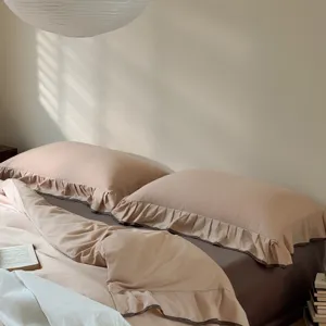 Cotton bedding set with elegant ruffle design, solid color duvet cover and pillowcases.