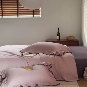 Cotton 4-piece bedding set with elegant ruffle edge, solid pink and purple design for all seasons.