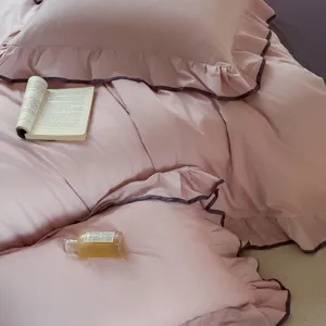 Cozy cotton solid color ruffled bedding detail, soft pink purple duvet cover set view.