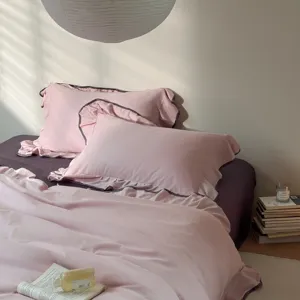 Pure cotton four-piece bedding set with elegant ruffles, soft pink solid color for all seasons.