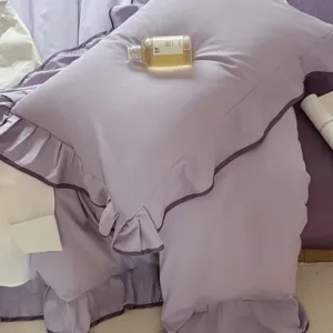 Purple cotton duvet cover set with elegant ruffles, breathable fabric for all-season use.