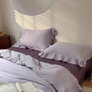 Pure cotton bedding set in elegant purple, featuring romantic lace ruffles and soft texture.