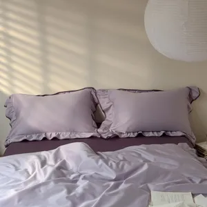 Cotton lavender bedding set with ruffle pillowcases and soft duvet cover for bedroom decor.