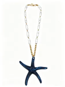 Close-up of blue starfish pendant necklace with white baroque pearls and gold beads
